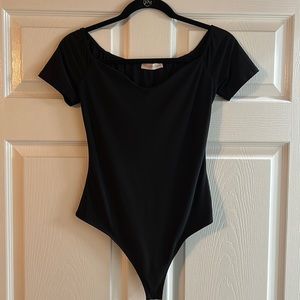 Black bodysuit with slight V in the front